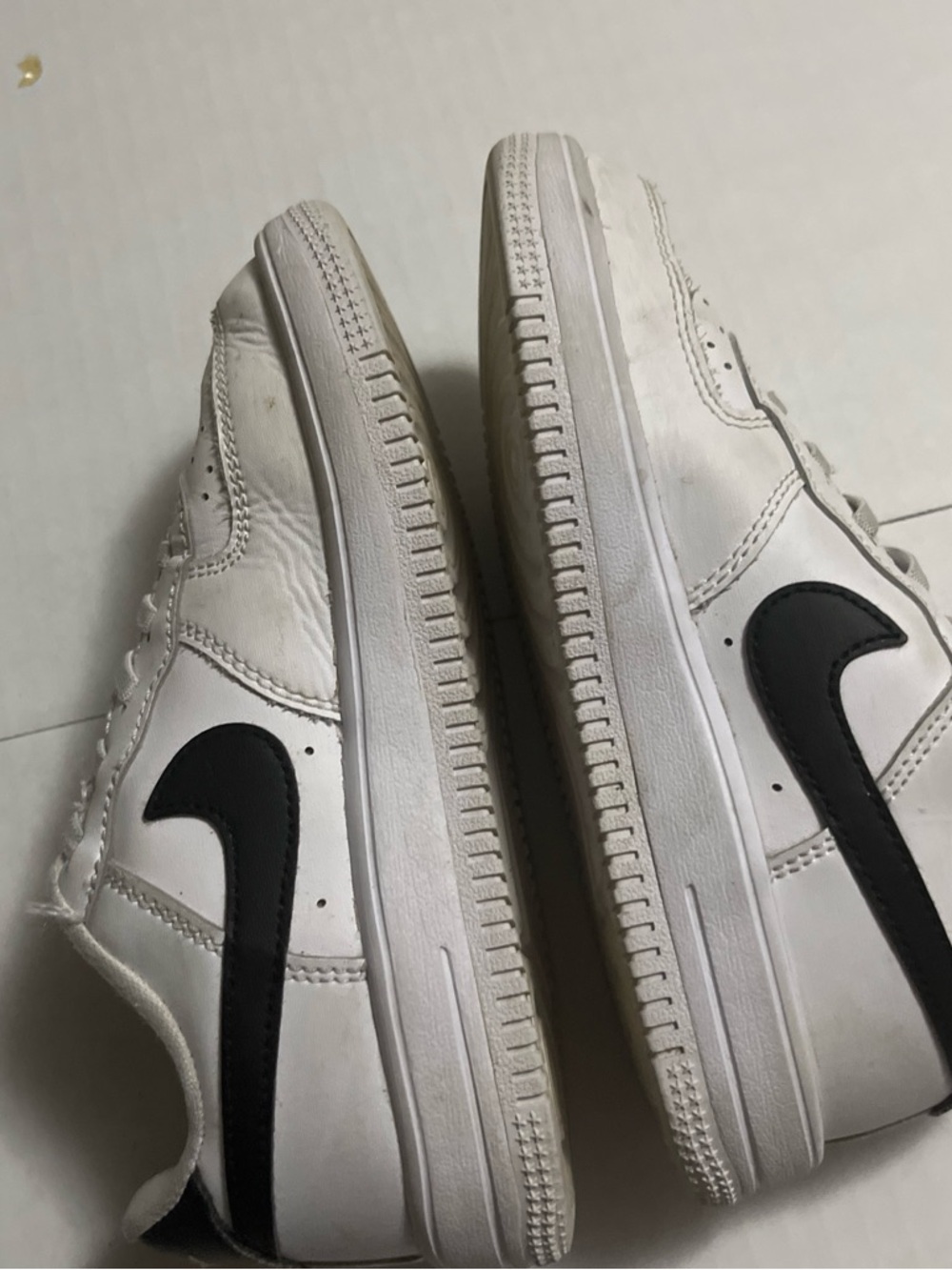 Nike White Low-Top Sneakers with Black Swoosh Accent